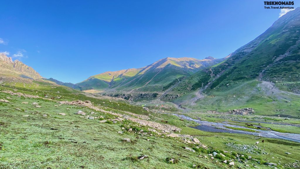 Start of Day 2. The Nichnai Pass which we were to cross is towards left of the picture. There was a waterfall next to the pass, which we had to cross. From our camp site, this looked very daunting. However, with a new day, we started climbing towards this pass. Kashmir Great Lakes Trek - Premium