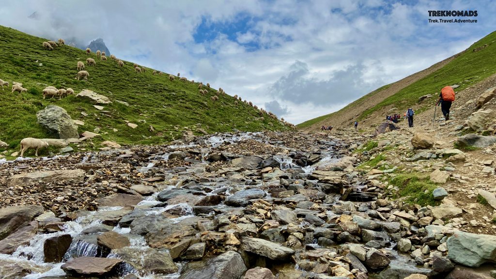 We were near the Nichani Pass. The waterfall which we saw from our camp, was flowing next to us. We were at almost 4,000 meters above sea level. After 1 km of flat at the top and a short climb, we were at the Nichnai Pass. Kashmir Great Lakes Trek - Premium