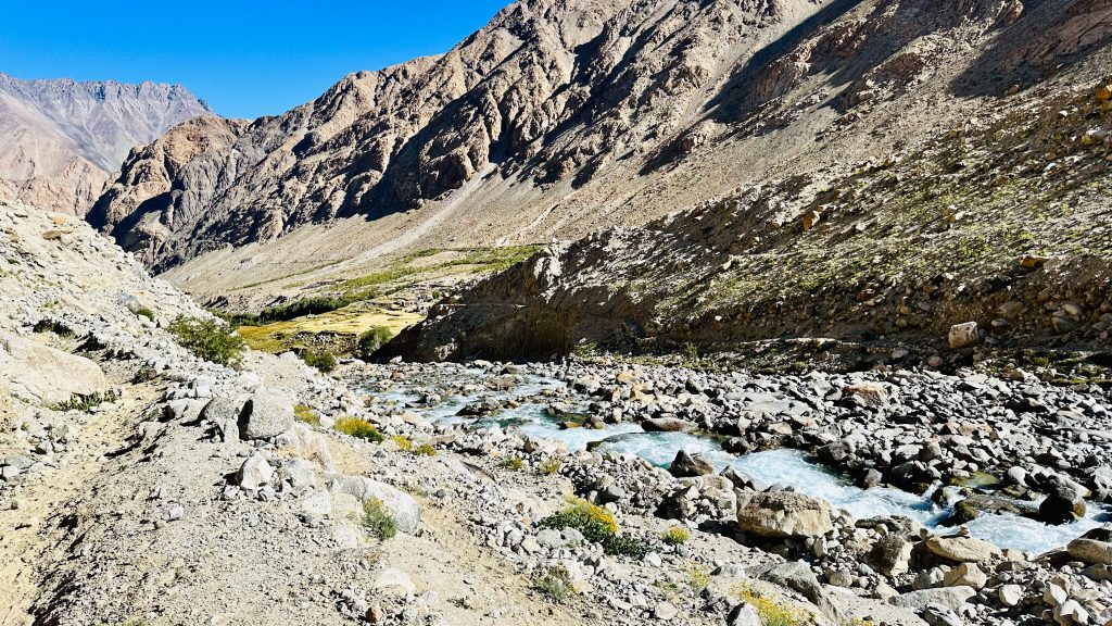 glacial stream, river, ice water, icy water, panaromic view, mountain, clouds, valley